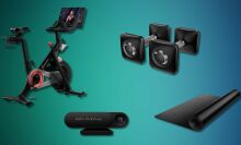 Peloton bike, mat, dumbells and AI-device on an abstract background