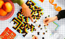 people completing puzzle