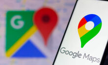 The Google Maps logo seen displayed on a smartphone and in the background.