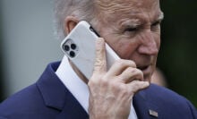 US President Joe Biden on a smartphone during a National Small Business Week event in the Rose Garden of the White House in Washington, DC, US, on Monday, May 1, 2023. 