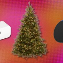 a pre-lit holiday tree sits between an amazon echo pop smart speaker and a smart plug