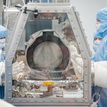 NASA scientists opening the OSIRIS-REx Asteroid Sample Return lid at the Johnson Space Center.