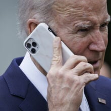 US President Joe Biden on a smartphone during a National Small Business Week event in the Rose Garden of the White House in Washington, DC, US, on Monday, May 1, 2023. 