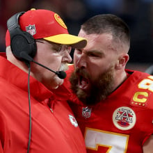 Travis Kelce #87 of the Kansas City Chiefs reacts at Head coach Andy Reid in the first half against the San Francisco 49ers during Super Bowl LVIII at Allegiant Stadium on Feb. 11, 2024, in Las Vegas, Nevada.
