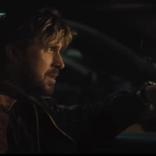 Ryan Gosling sits in his car crying.