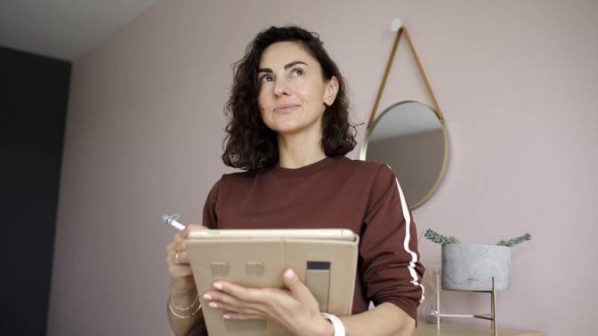 woman designing on a tablet