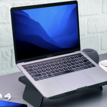 macbook sitting on elevate laptop stand on desktop