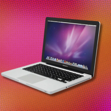 The 13-inch MacBook Pro overlaid on a bright, orange-pink background