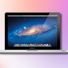 2015 Apple MacBook Pro with pink gradient background