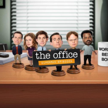 The Office cast as bobble heads on desk 