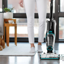 woman vacuuming floor 