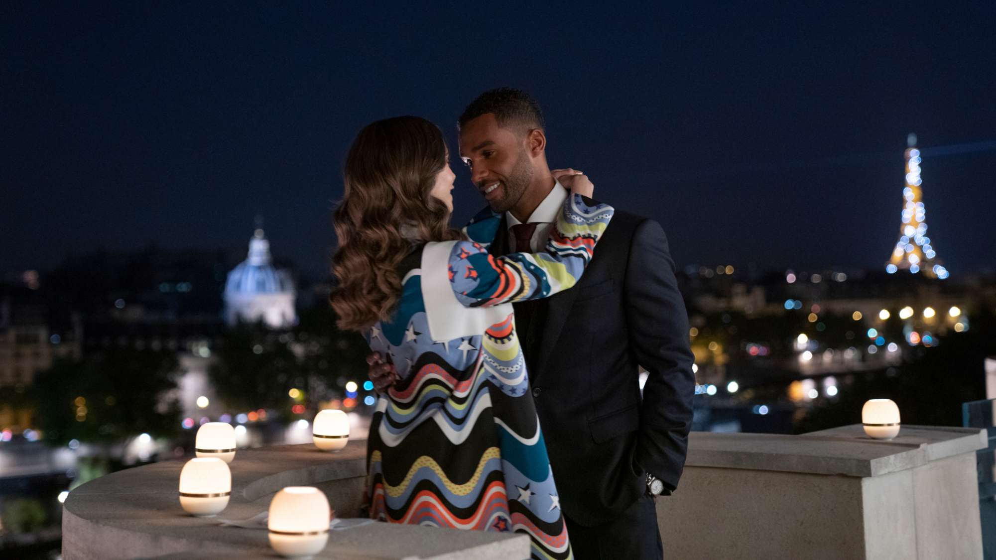 A scene from "Emily in Paris" Season 2: couple kissing in Paris
